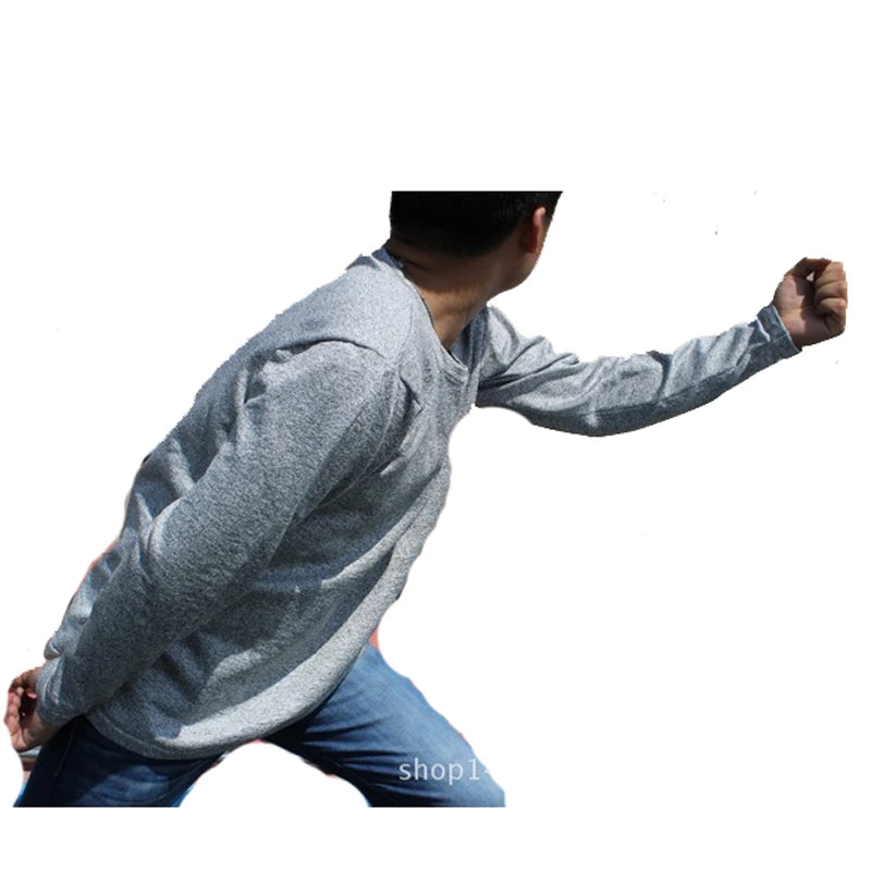 Person wearing a gray long-sleeve shirt and blue jeans on a white background
