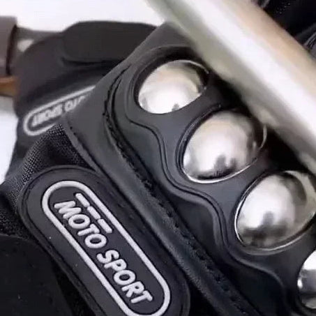 Motorcycle glove with metal balls on a red promotional banner